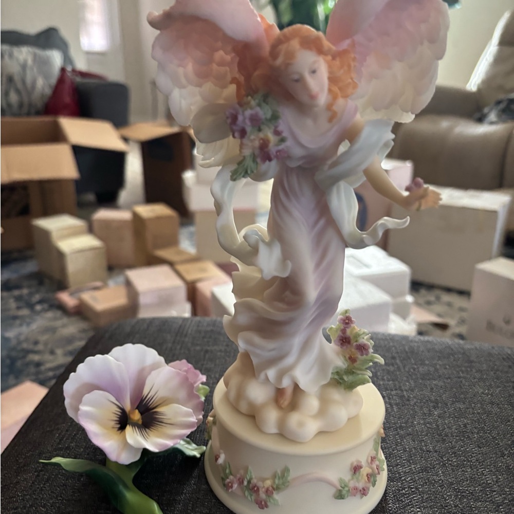 Elegant Angel Figurine with Floral Accents